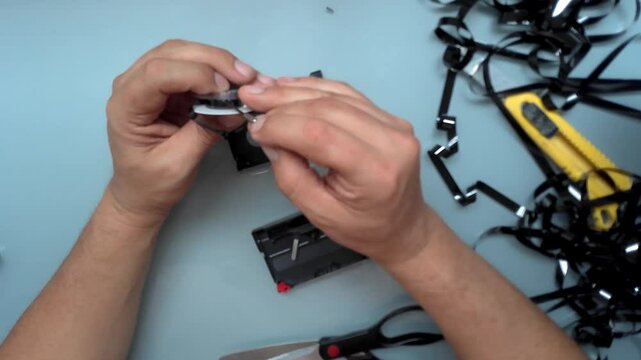 Repair and restoration of 8mm Hi8 Digital8 video tapes. Close-up