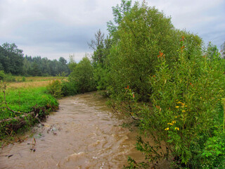 A small river overflowing after heavy rain