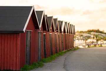 Fototapeta premium Long row of red boat houses.