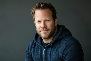 Fototapeta premium Portrait of a Man Wearing a Blue Hoodie