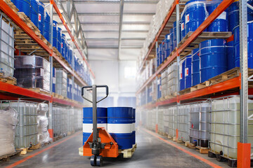 Chemical company warehouse. Barrels on pallet racks. Storage area for chemical products. Forklift...