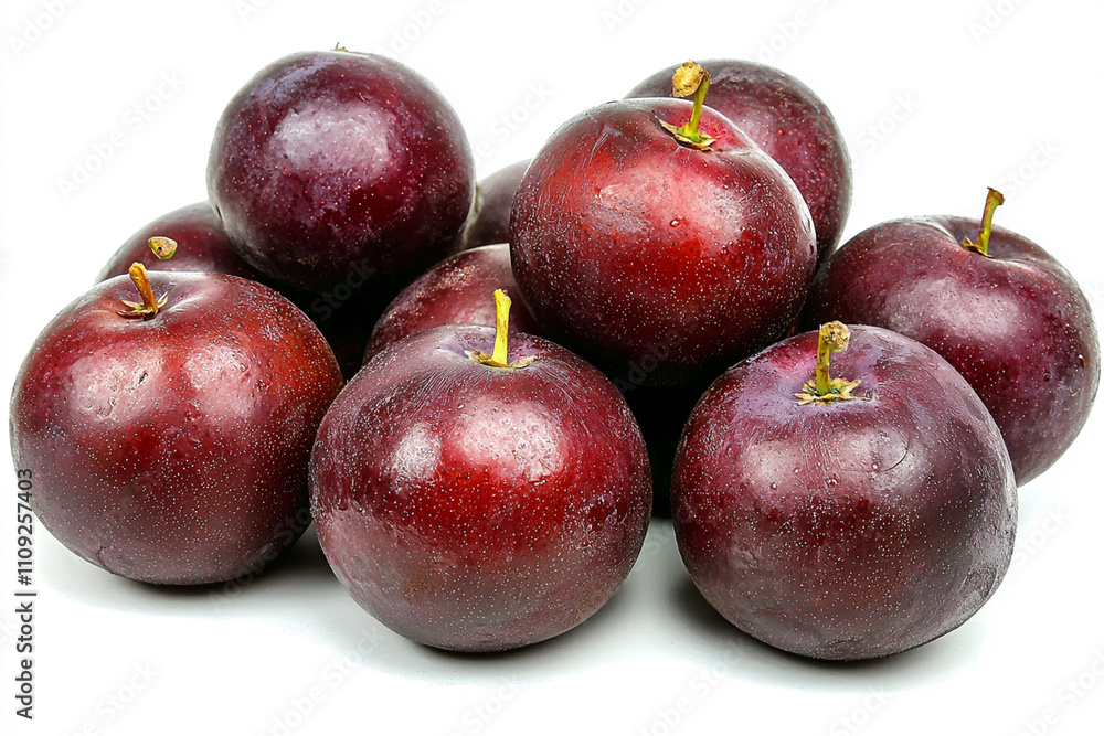 Poster red plums arranged neatly on a white surface for display