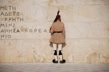 Athens, Greece / September 2023: The presidential palace guard in traditional Greek Tsolias outfit outside the Fallen Soldier monument at Syntagma square. 