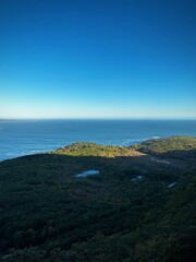 Sunlight hits the coastal hills of Maine (Acadia National Park, Maine, USA)