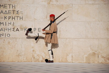 Athens, Greece / September 2023: The presidential palace guard in traditional Greek Tsolias outfit outside the Fallen Soldier monument at Syntagma square. 