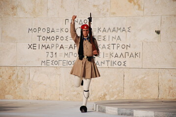 Athens, Greece / September 2023: The presidential palace guard in traditional Greek Tsolias outfit outside the Fallen Soldier monument at Syntagma square. 