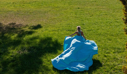 Autumn Fashion Photoshoot: A Beautiful Woman and a Wind-Swept Blue Dress