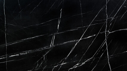 A black and white photo of a marble floor with a lot of cracks. The cracks are very visible and the floor is very dark