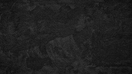 A black wall with a white paint. The wall is very plain and has no decorations. The wall is made of concrete. black texture background for template, page or web banner