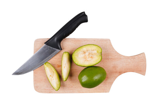 Freshly cut kedondong or ambarella fruit on a wooden chopping board isolated transparent