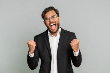 Happy joyful Indian businessman celebrating success victory, winning birthday, lottery jackpot goal...