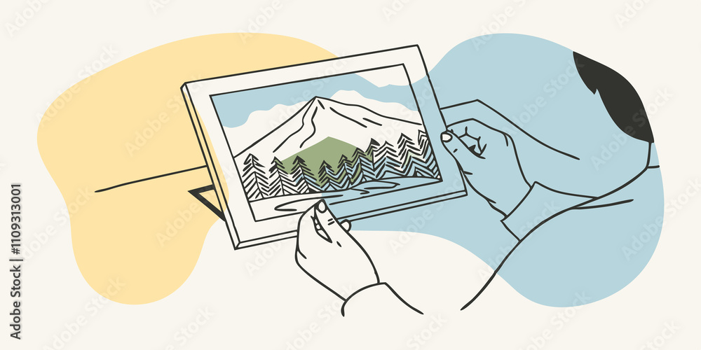 Poster adhering photos with a focused expression the person carefully glues down a stunning landscape photo