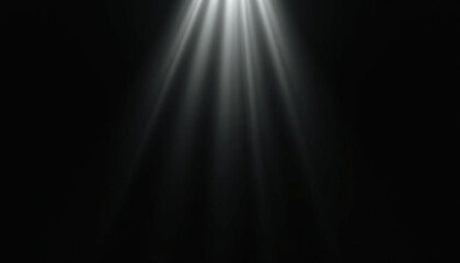 Bright light rays emanating from above  casting dramatic shadows on a dark background.