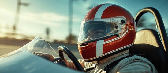 Obraz premium Racing driver in a helmet focused on the track ahead.