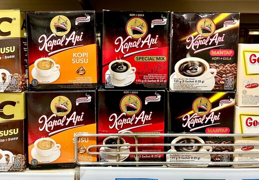 Jakarta, Indonesia - November 30th, 2024 - Kapal Api instant coffee boxes on supermarket shelf isolated on horizontal background.