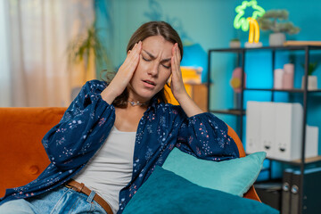 Sick ill Caucasian woman rubbing temples to cure headache problem, suffering from tension and...
