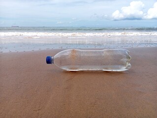Empty plastic bottle on the beach 