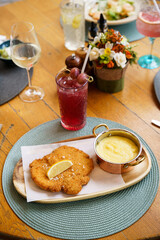 Traditional schnitzel with potato puree and cucumber salad