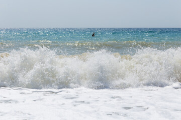 Sea view while sailing on a board in storm waves 