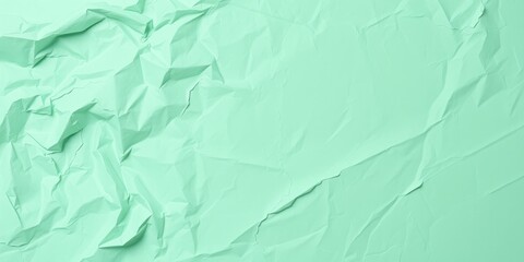 Obraz premium Abstract Crumpled Mint Green Paper Texture for Backgrounds and Design Projects