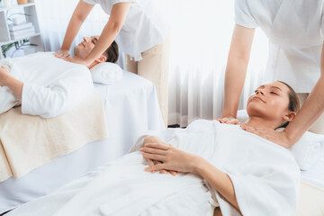 Caucasian couple customer enjoying relaxing anti-stress spa massage and pampering with beauty skin...