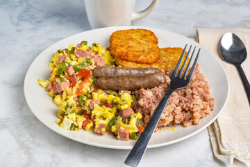 scramble eggs  with  corn beef hash and  sausages