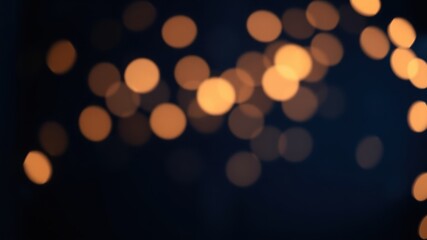 Obraz premium Abstract Bokeh Background of Defocused Golden Lights on a Deep Blue Canvas