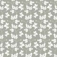 Seamless pattern with plant silhouettes. Decorative vintage pattern in Japanese style with leaves and twigs on a gray background. Print for wallpaper, fabric, packaging, paper, clothes, dishes.