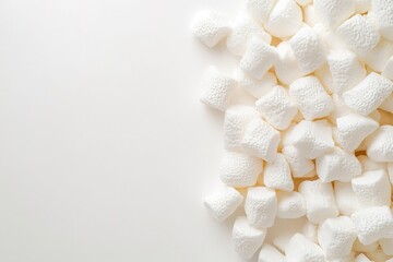 Obraz premium White marshmallows on one side, space for text.