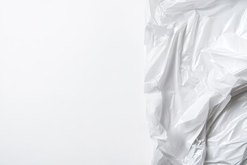 Obraz premium Crumpled white plastic texture on left with ample empty space