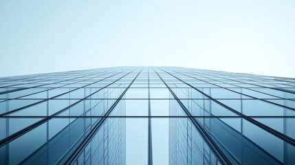 Fototapeta premium A minimalist glass tower, viewed from the ground, showing clean reflections of the sky