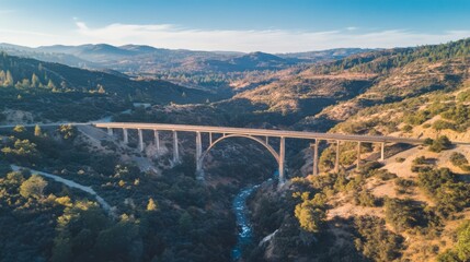 Scenic aerial view of a long bridge spanning a valley.