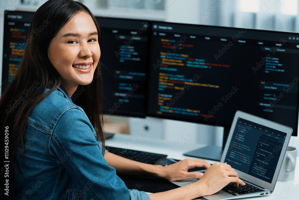 Poster young asian in it developer looking at camera to present with online information on pc with coding p