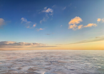 Aerial View Of Sunrise Over A Snowy Agricultural Landscape