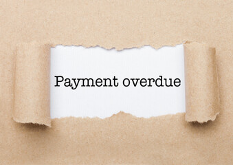 Payment Overdue text appearing behind brown paper