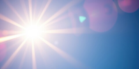 A radiant sun radiating bright light through the blue sky with soft lens flare overlays