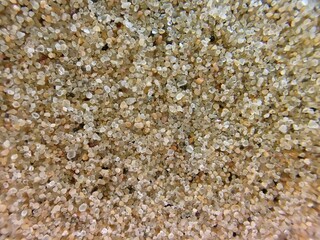 Makro Aufnahme am Sandstrand als Hintergrund mit Vignette