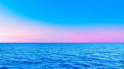 Obraz premium The tranquil sea mirrors a dawn sky adorned with golden and pink shades, making it perfect for morning-themed wellness and fitness promotions.