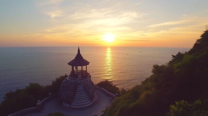 Obraz premium Andaman Sea Sunset at Windmill Viewpoint - Stunning sunset over the Andaman Sea, viewed from a scenic windmill viewpoint. Peaceful, serene, tropical, golden hour, coastal.