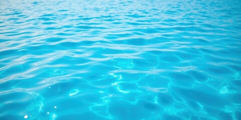 Obraz premium A Closeup of a Crystal Clear Blue Water Surface with Gentle Ripples and Shimmering Light Reflections