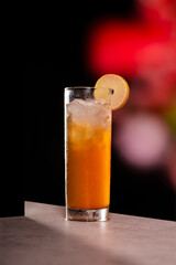 cold tea lemon on dark background