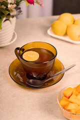a glass of warm lemon tea