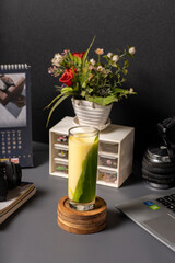 a glass of jelly drink with sweet corn soup