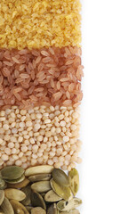 Different types of cereals, legumes and seeds isolated on white, top view