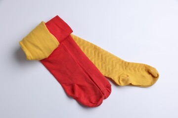 Different child's tights on white background, top view