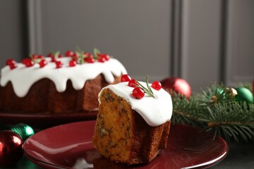 Traditional classic Christmas cake and decor on gray textured table