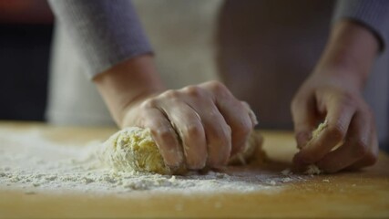 Hands kneading dough for homemade bread or pastries	