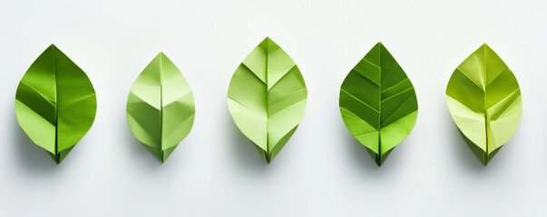 Green paper origami leaves arranged in a row banner