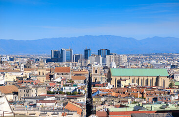 View of Spaccanapoli street splitting city center of Naples. Napoli city skyline with historical Old town, Spaccanapoli street and modern financial district skyscrapers, Italy.