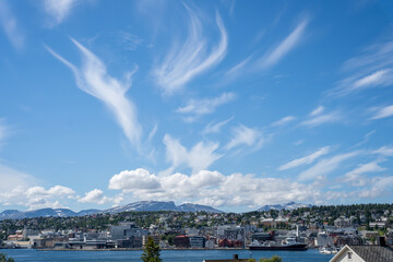Tromso, Norway - 07.04.2024: Cirrus clouds in blue sky over Tromso, Norway